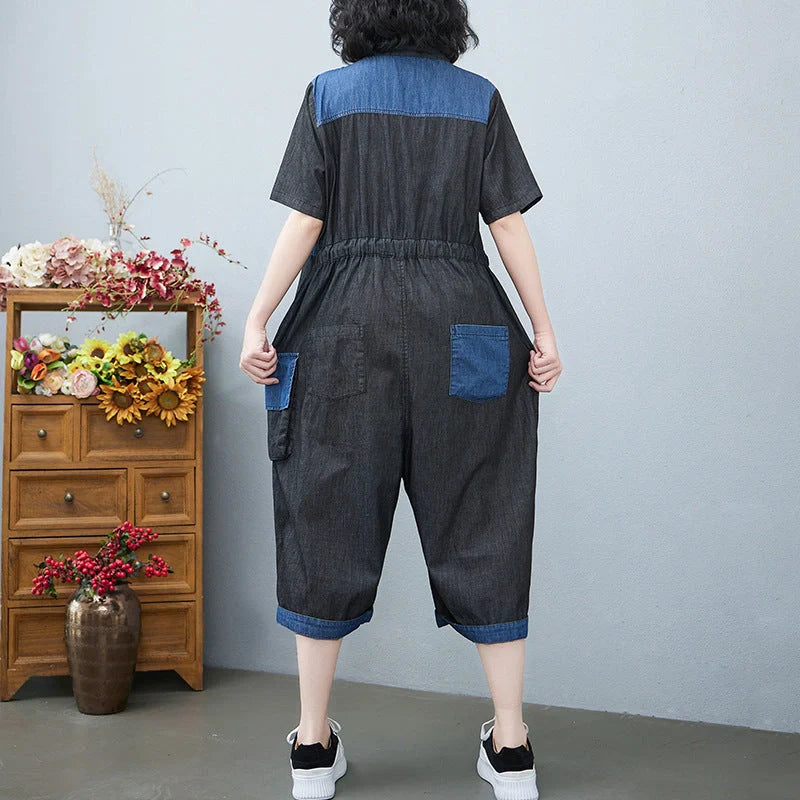 Women's denim drawstring jumpsuit with wide legs and cropped length, available in blue and black colours