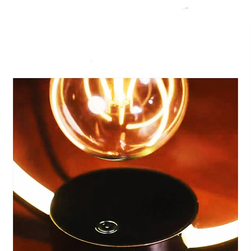Magnetic Levitation Bulb floating above its base with a black metal shade