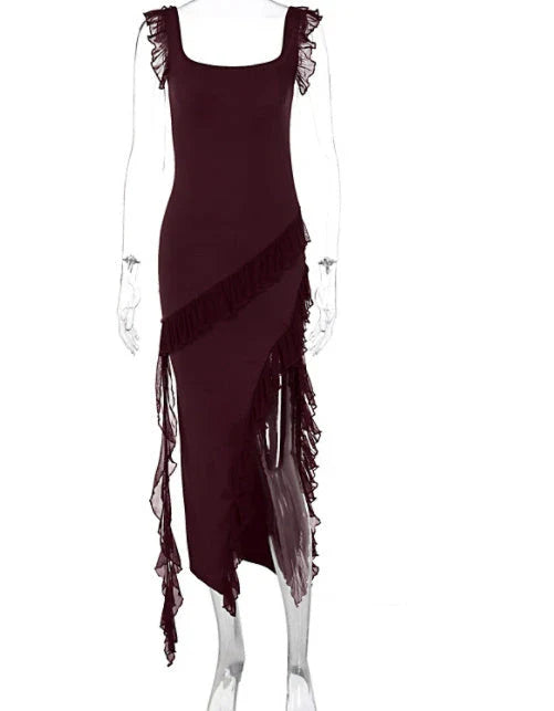 Elegant satin slip dress with ruffle detailing and thigh-high slit, available in various colours and sizes.