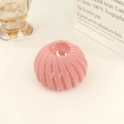 Elegant hair circle accessory with flexible design and teeth for creating stylish ponytails