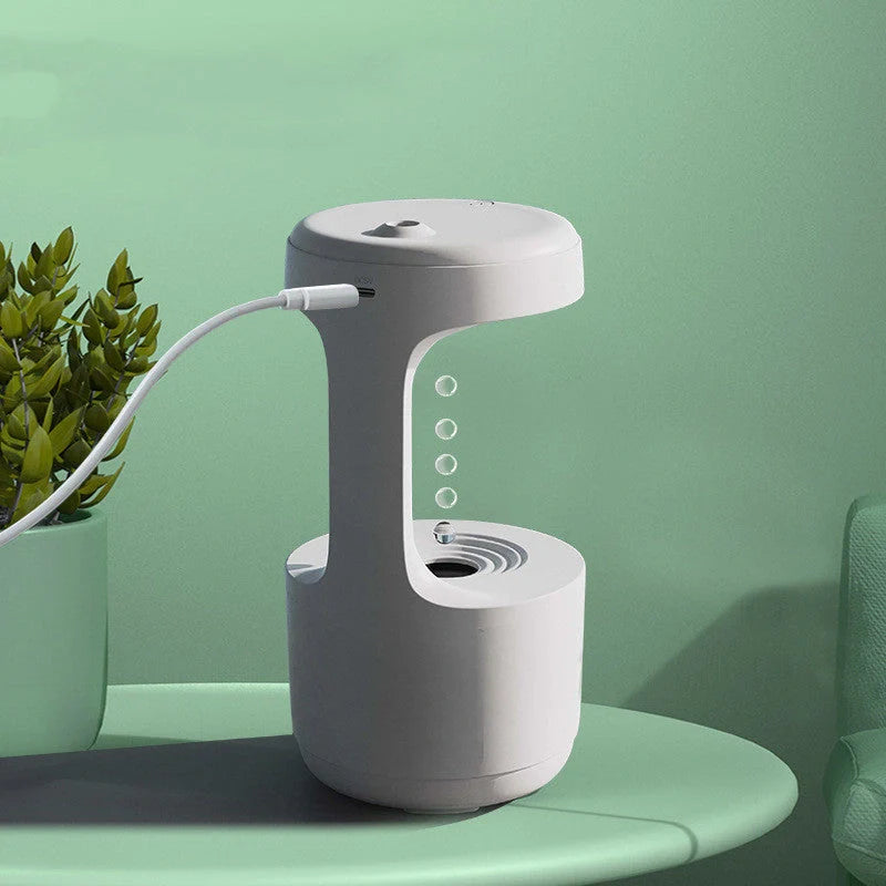 Anti-gravity humidifier with LED display and aroma diffuser in white, green, and black