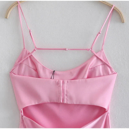 A sleek and elegant satin slip dress in a stunning pink color with a backless design and full-length silhouette.