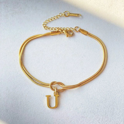 Personalised gold and silver love knot bracelets for couples, perfect as Valentine's Day gifts.