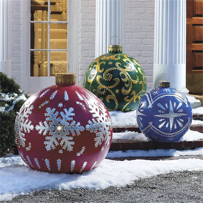 Vibrant inflatable Christmas baubles in a variety of colours and patterns, perfect for outdoor holiday decoration