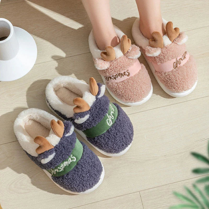 Cozy elk-themed slippers in a variety of festive colors, featuring a plush suede upper and supportive EVA sole for maximum comfort and warmth.