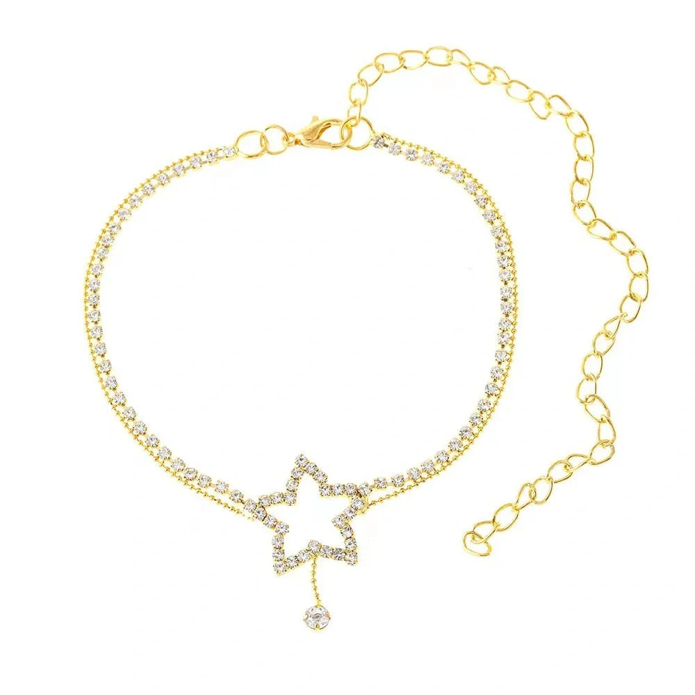 Sparkling star-shaped rhinestone necklace and anklet jewellery set in gold and silver tones