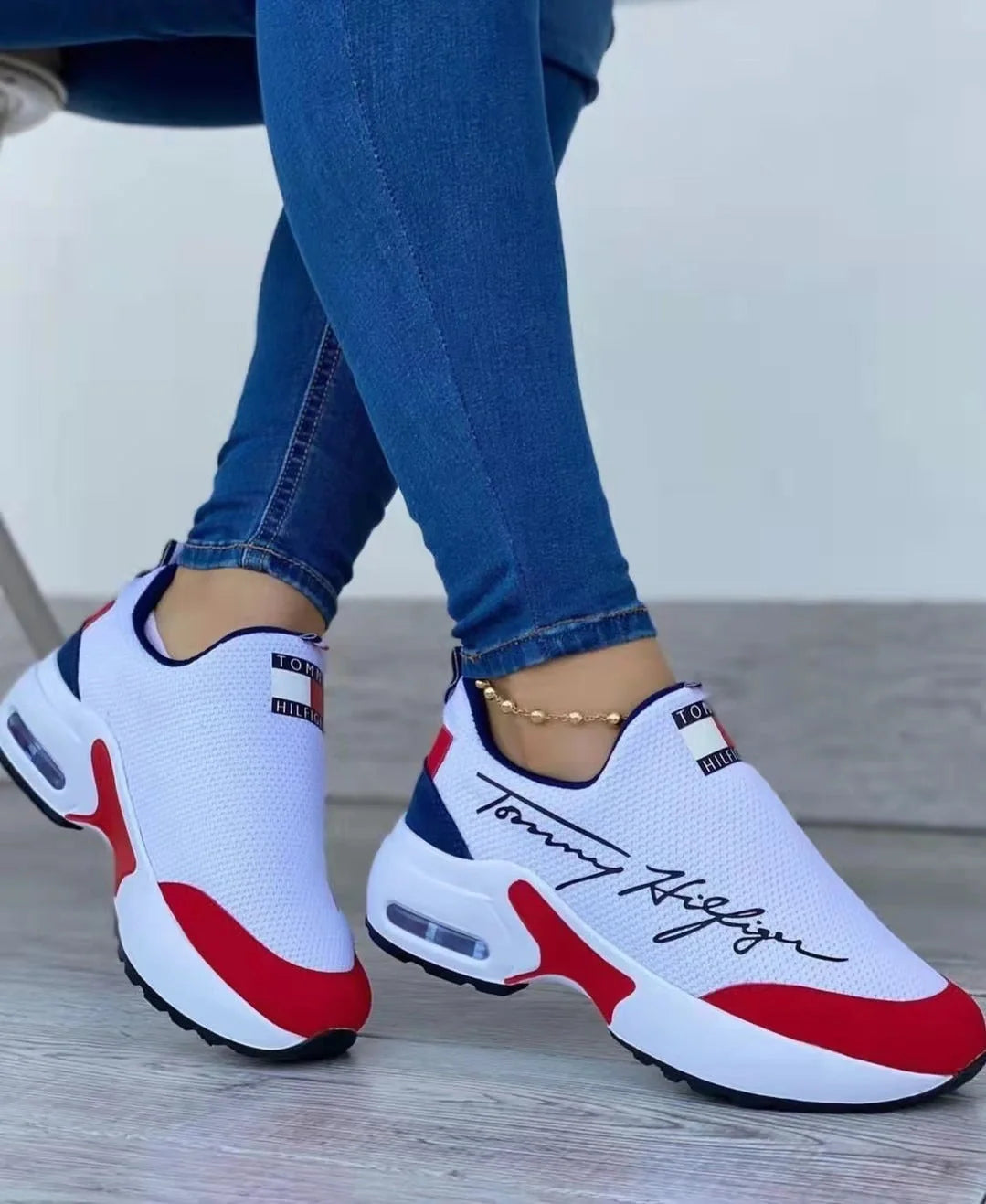 Women's Air Cushion Slip-on Sneakers in white, red, black, and navy blue
