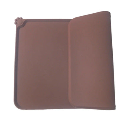 Spill-proof pet food mat made of durable silicone with non-slip base and raised edges to prevent messes