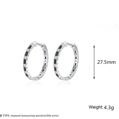 A pair of elegant black zircon earrings with a round, geometric design made of premium copper