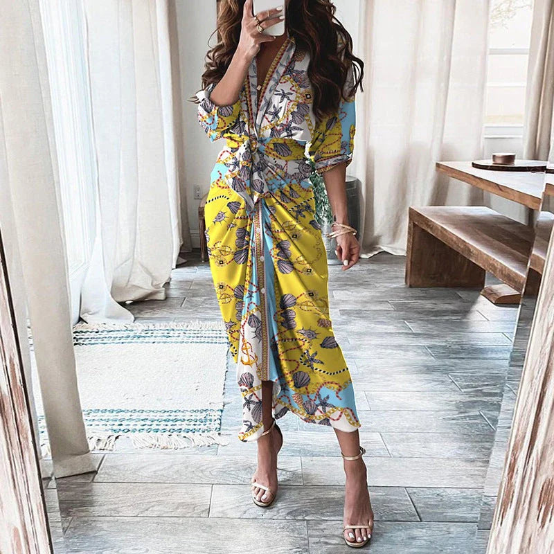 A beautiful floral wrap dress with lace-up detailing, featuring a deep V-neck and full-length skirt for a flattering, elegant look.