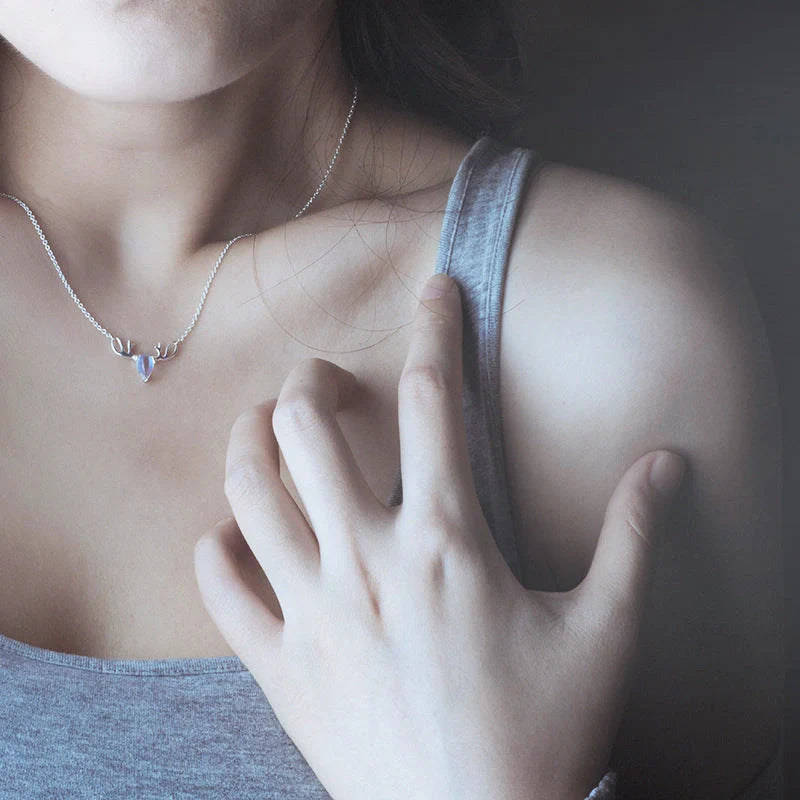 Elegant silver-toned elk necklace with a captivating moonstone pendant, a stunning Korean-inspired jewellery piece