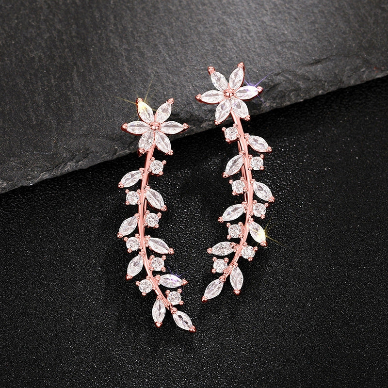 Stylish diamond flower earrings for women in white gold, gold, and rose gold
