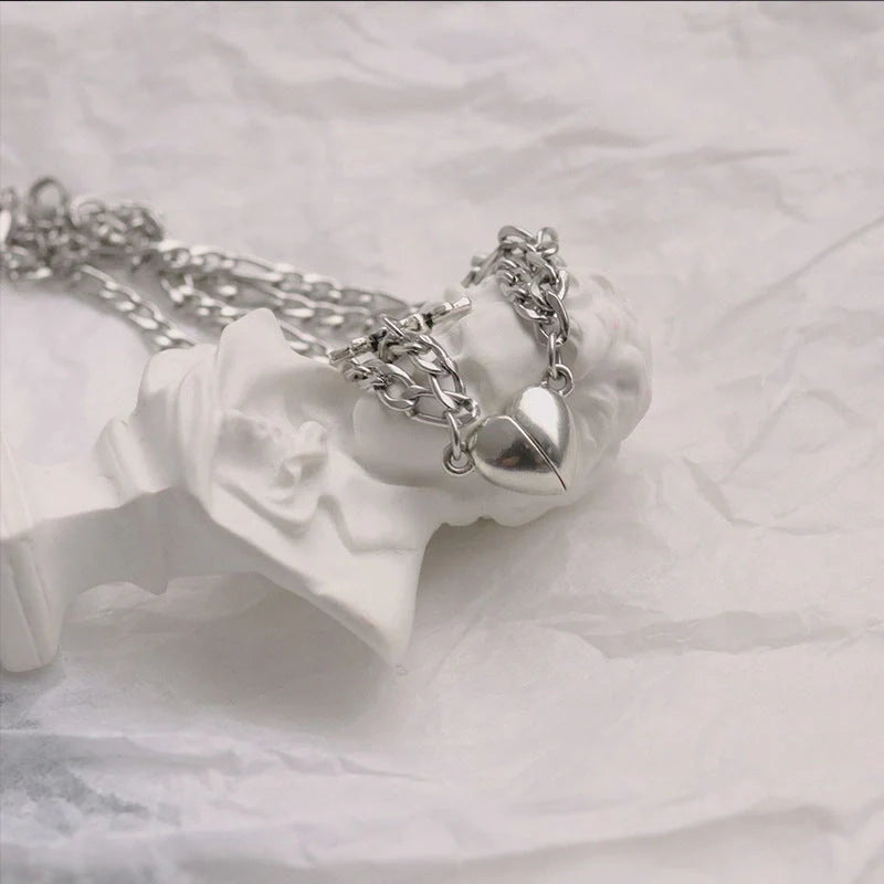 Floral heart-shaped couple bracelets with adjustable iron chains, symbolising love and friendship.