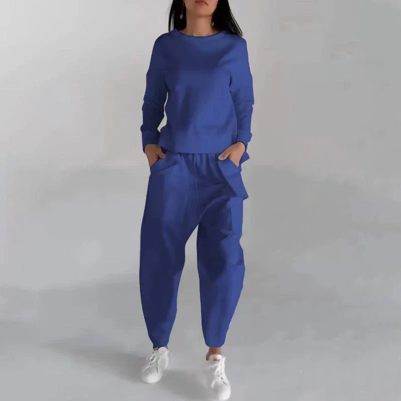 Stylish polyester sweatshirt with back slit, pockets, and available in various colors