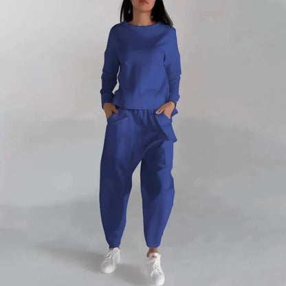 Stylish polyester sweatshirt with back slit, pockets, and available in various colors