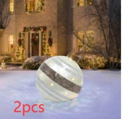 Vibrant inflatable Christmas baubles in a variety of colours and patterns, perfect for outdoor holiday decoration