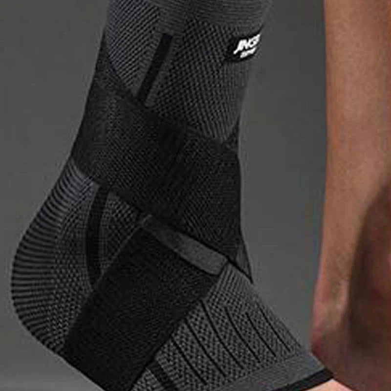 Sports compression ankle protector in black, green, and orange colours