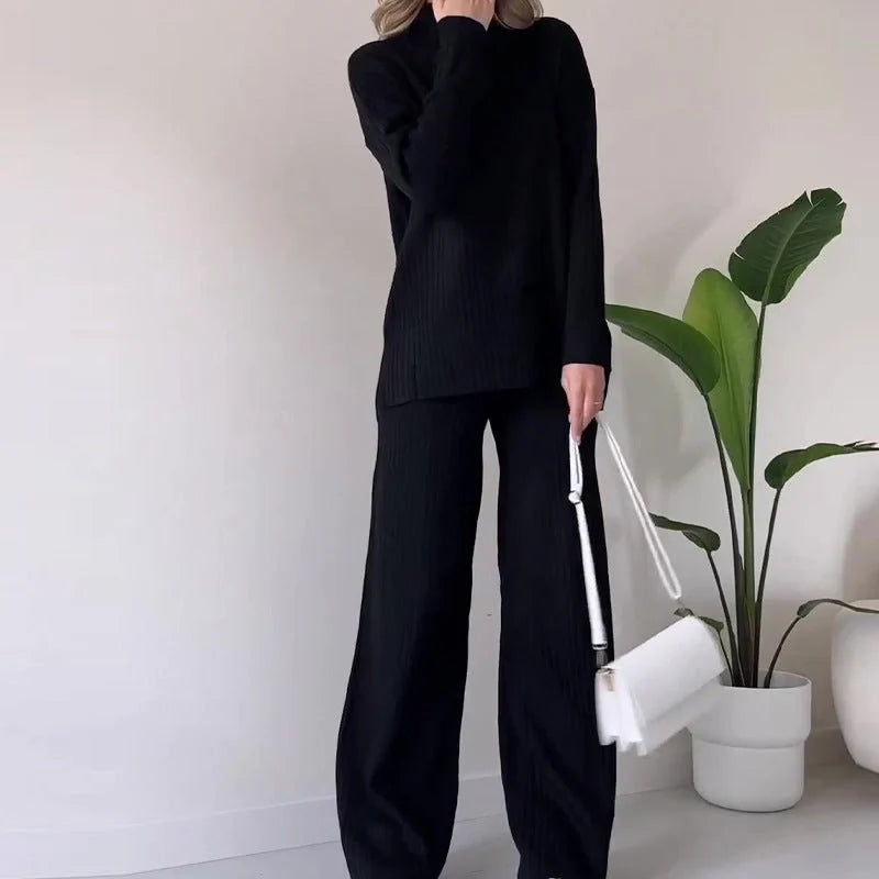 Women's turtleneck knitted suit set in white, black, or green with loose fit and straight trousers