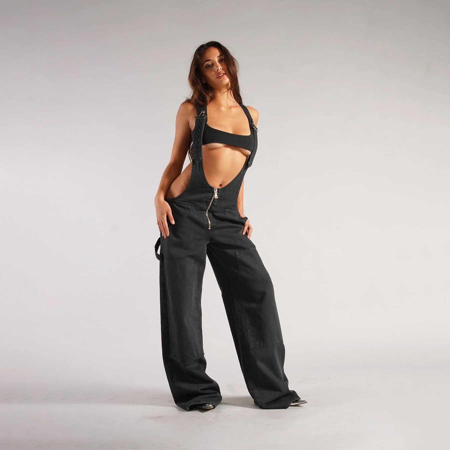 Stylish denim overalls with adjustable suspender straps, front and back pockets, and a comfortable micro-elastic fit, available in a variety of chic colors.
