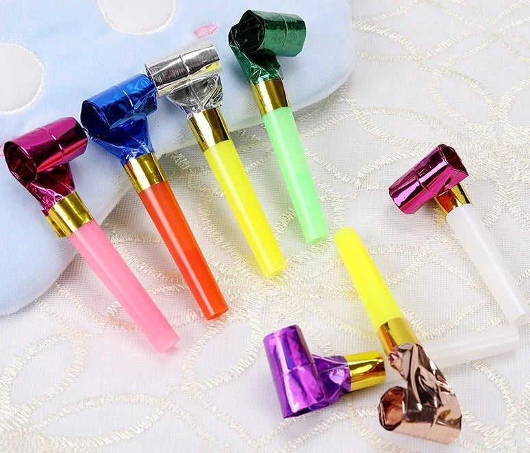 Colourful dragon-themed party favours made of high-quality plastic, including sticks and hammers in a variety of vibrant hues