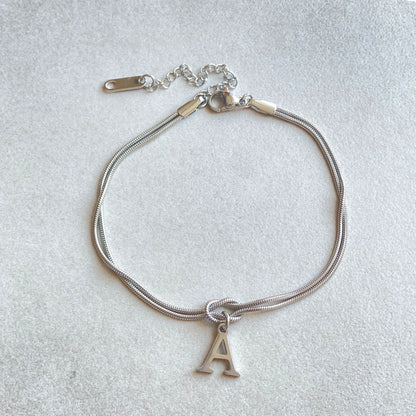 Personalised gold and silver love knot bracelets for couples, perfect as Valentine's Day gifts.
