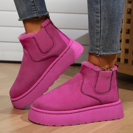 Stylish women's winter snow boots in various colours, featuring a thick sole and plush lining for warmth.