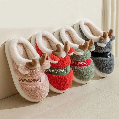 Cozy elk-themed slippers in a variety of festive colors, featuring a plush suede upper and supportive EVA sole for maximum comfort and warmth.