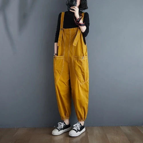 Stylish plus-size black and yellow dungarees in a comfortable, fashionable design for the modern commuter