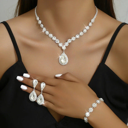 Elegant rhinestone jewelry set with necklace, earrings, and bracelet in a celestial-inspired design