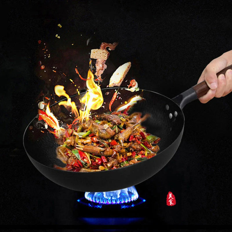 Traditional handmade iron wok with wooden handle and lid