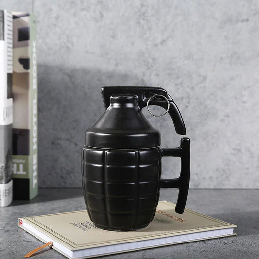 Grenade-shaped ceramic travel mug with secure lid, designed with a military-inspired style for use at home, work, or on the go