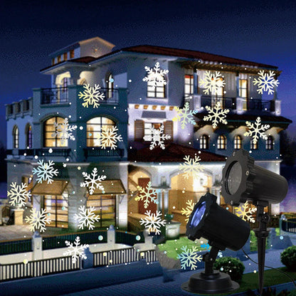 LED Christmas Blizzard Snowflake Laser Light Projector illuminating a garden with white snowflake patterns