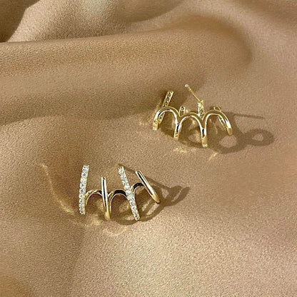 Radiant sterling silver earrings with four-prong zircon stone settings, elegant and fashionable jewelry for women