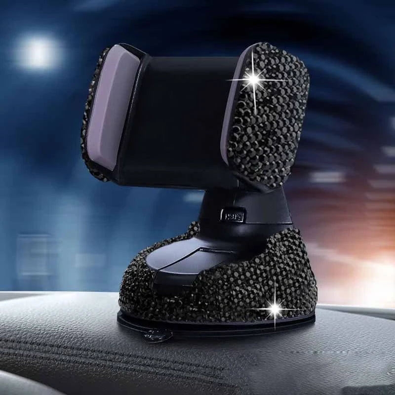 Diamond-encrusted car phone holder mounted on air vent with phone securely in place