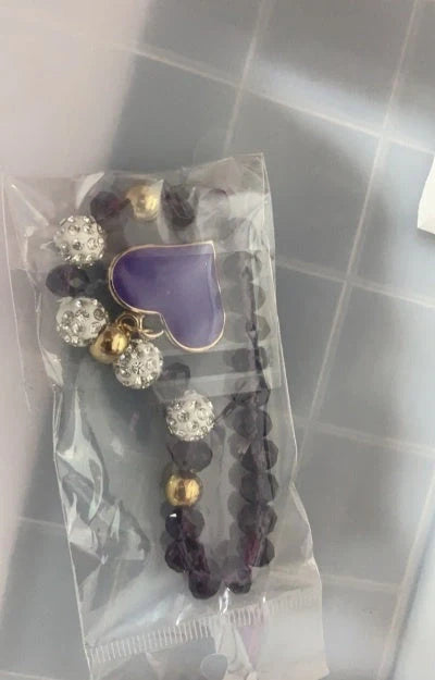 Elegant crystal heart-shaped bracelets in various vibrant colours, perfect for adding a touch of sophistication to any outfit