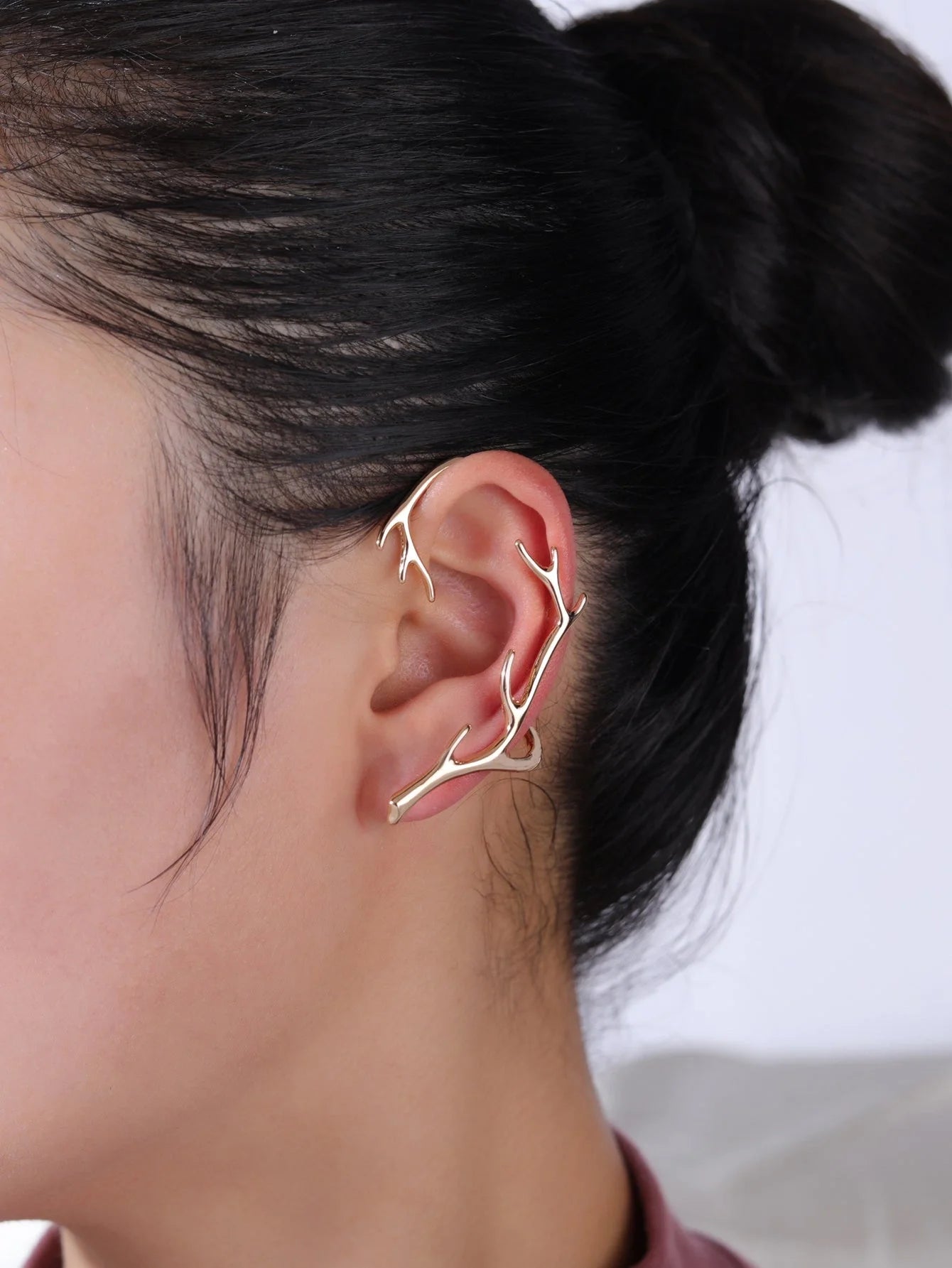 Vintage bone hypoallergenic elf earrings with geometric design in gold, silver, black, and green