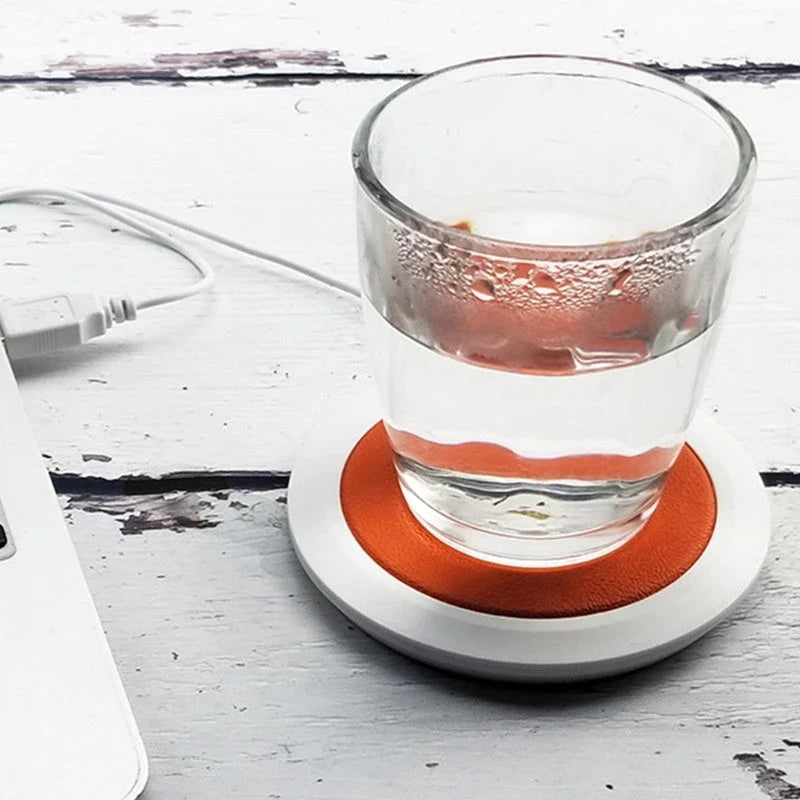 Sleek USB-powered cup warmer in various colors, keeping drinks hot and toasty