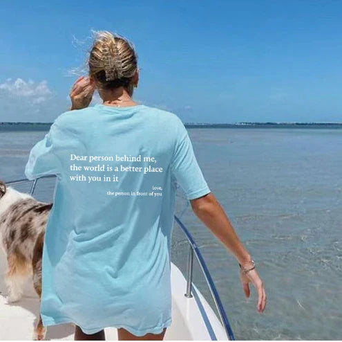 Women's graphic tee with playful slogan, available in various colors and sizes
