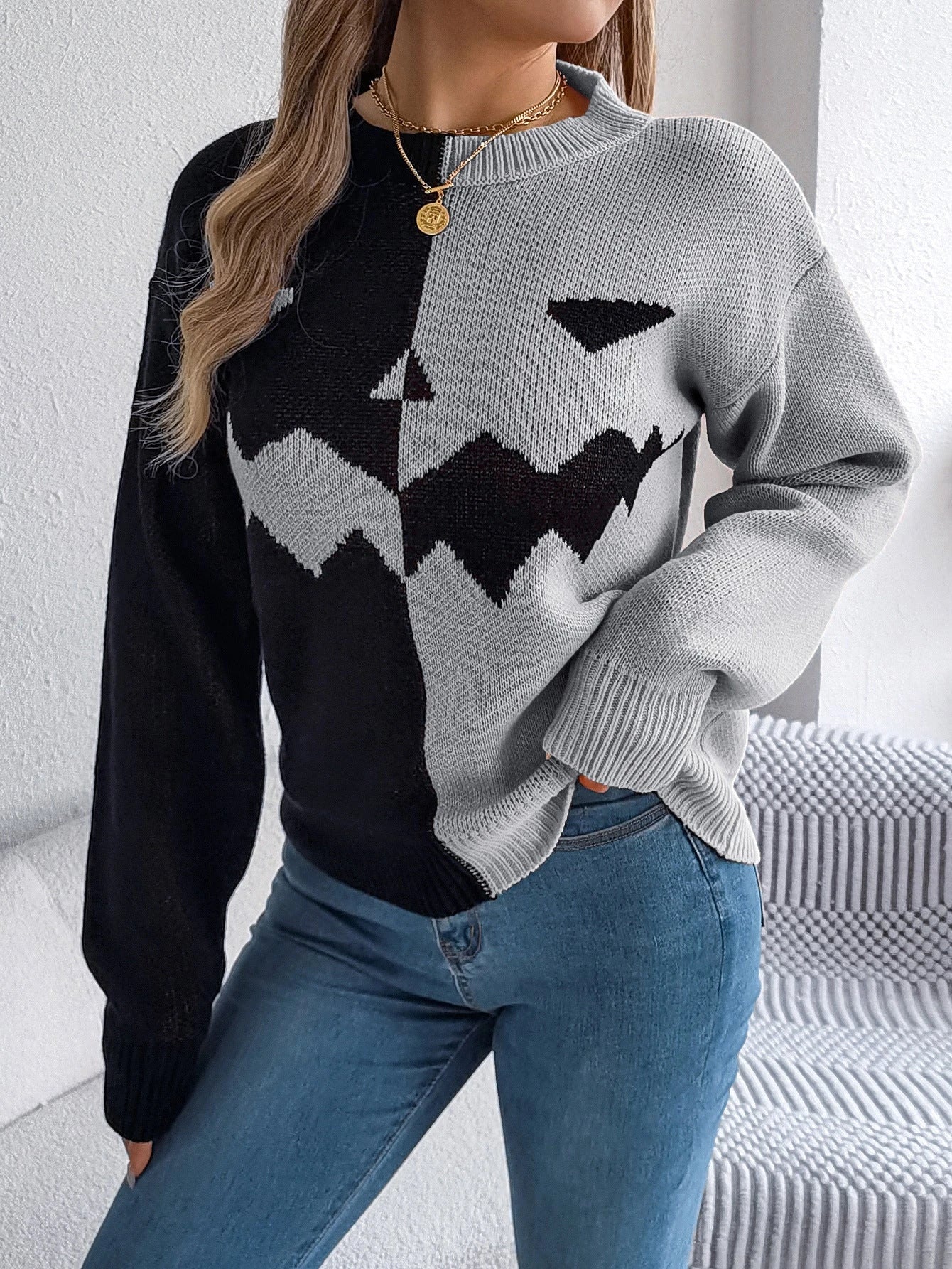A stylish Halloween pullover sweater with a ghost motif, available in a variety of vibrant colors and sizes.