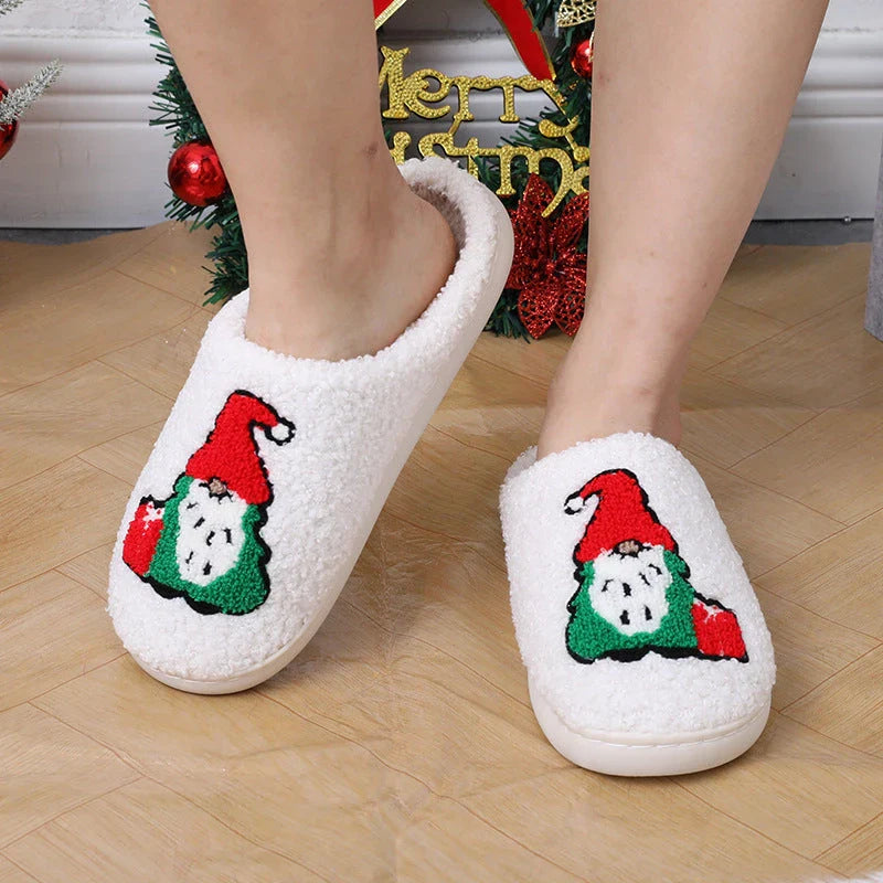 Cozy Christmas-themed slip-on slippers with a charming Santa Claus design, perfect for indoor comfort and warmth during the holiday season.