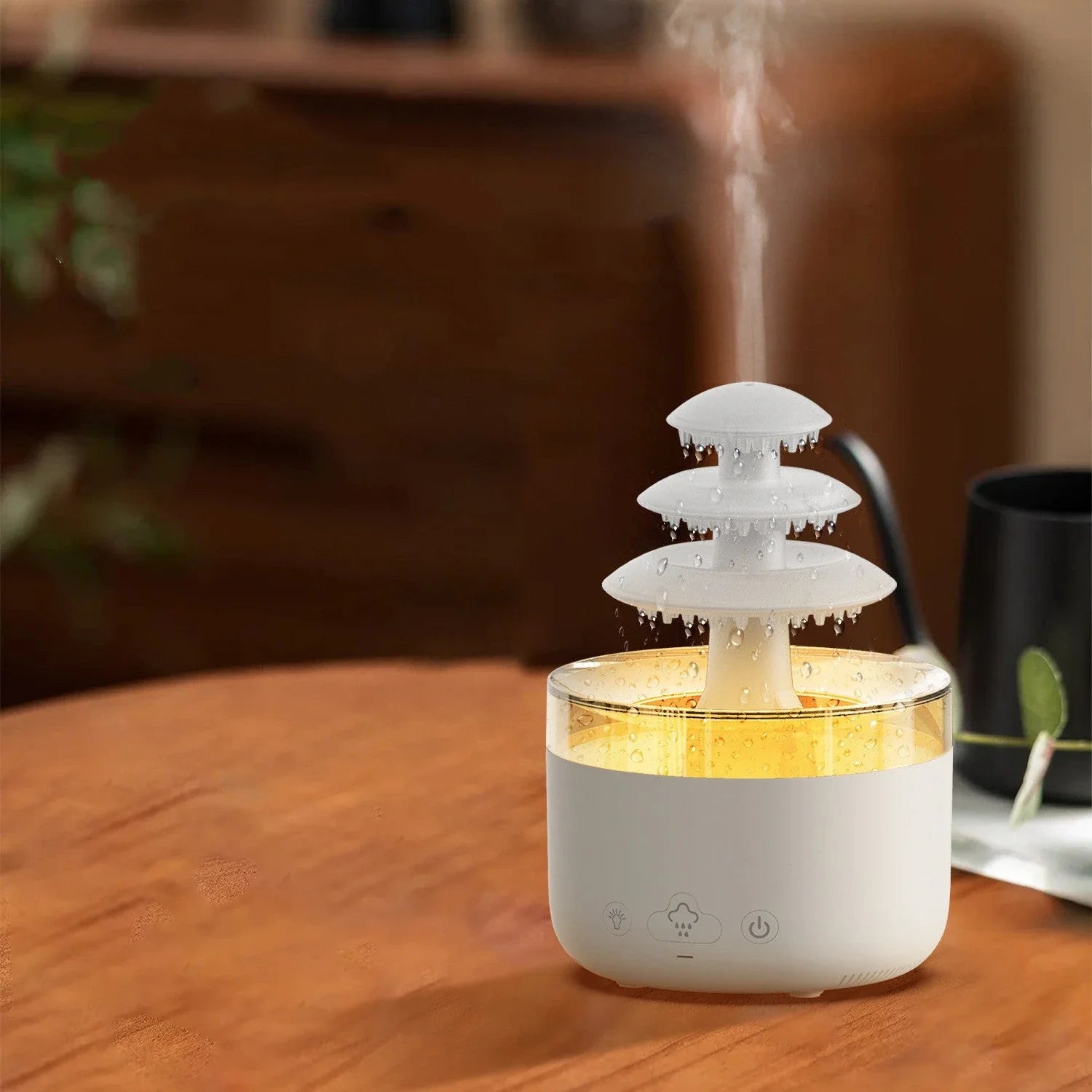 A white humidifier with a cloud-shaped design, featuring color-changing lights and essential oil diffuser capabilities.