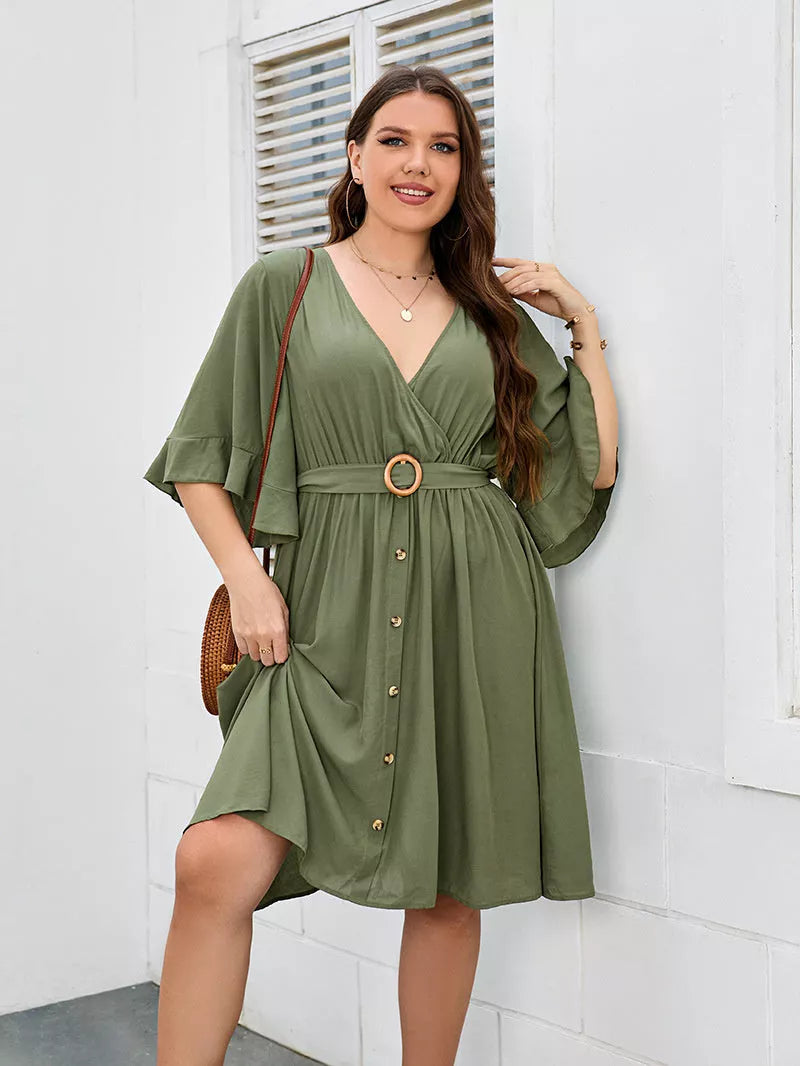 Plus-size green party skirt with V-neck and ruffle sleeves