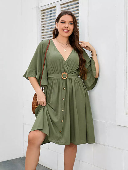 Plus-size green party skirt with V-neck and ruffle sleeves