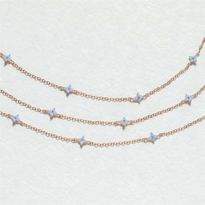 Elegant floral statement necklace in various color options, including golden blue, silver blue, golden green, and silver green, with an adjustable chain and high-quality construction.