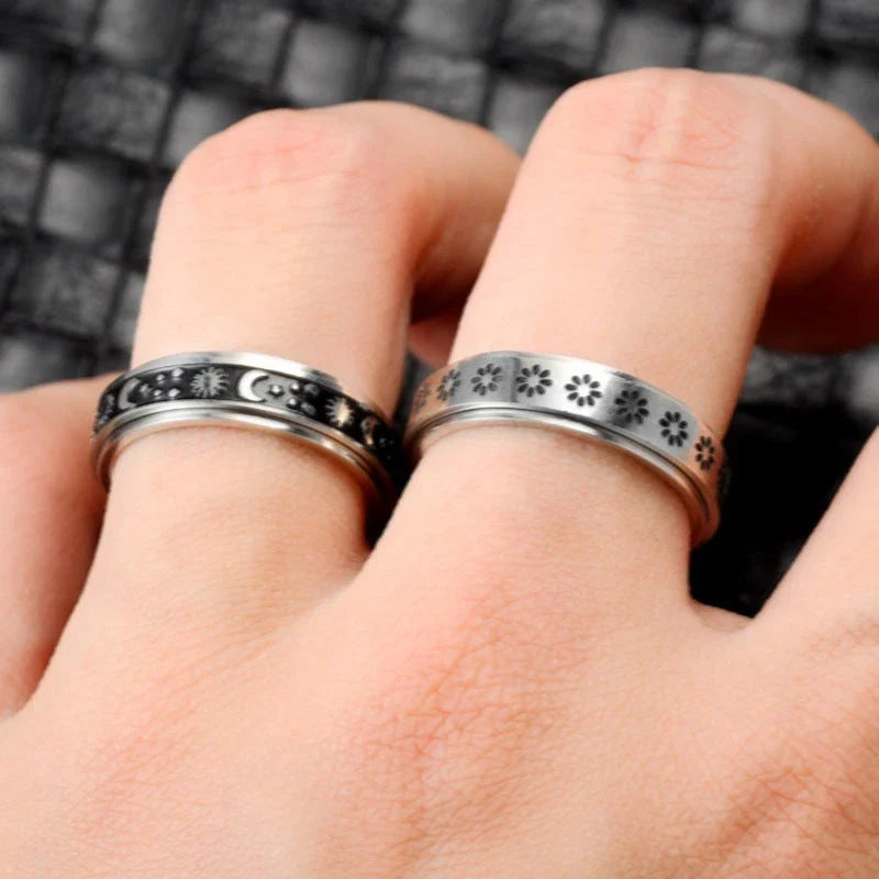 Elegant stainless steel spinner ring with a captivating moon and star design that rotates effortlessly for a calming tactile experience