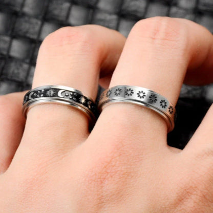 Elegant stainless steel spinner ring with a captivating moon and star design that rotates effortlessly for a calming tactile experience