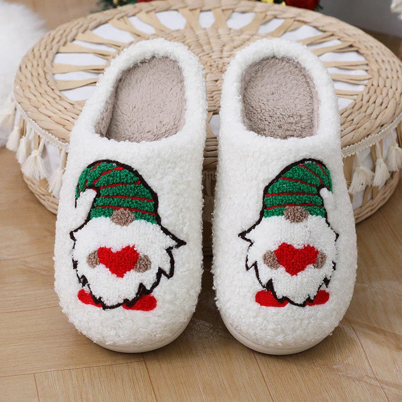 Cozy Christmas-themed slip-on slippers with a charming Santa Claus design, perfect for indoor comfort and warmth during the holiday season.