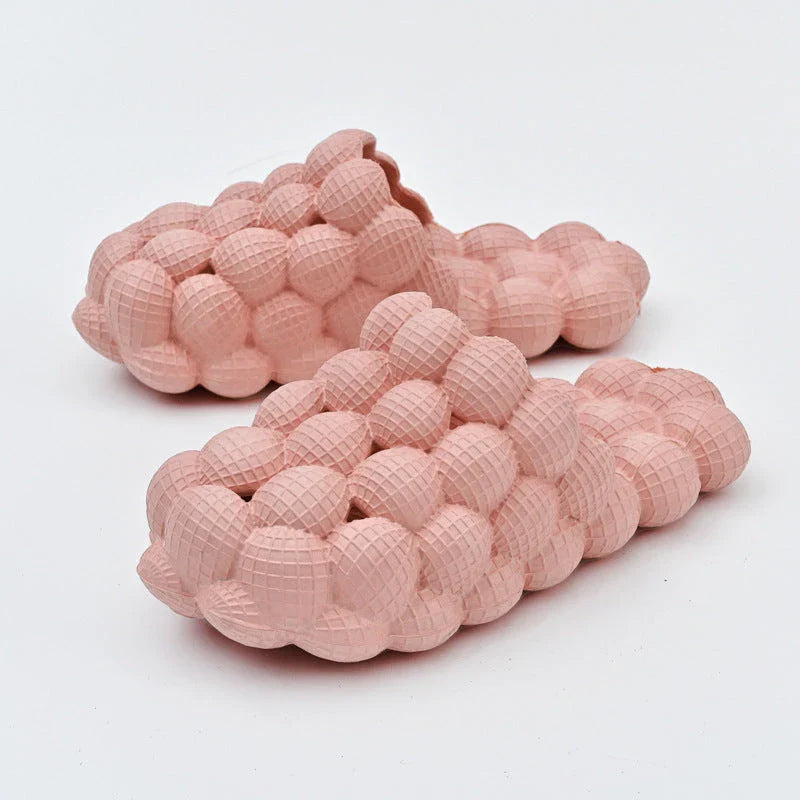 Comfortable massage bubble slides with breathable mesh upper and non-slip soles for indoor relaxation and pampering