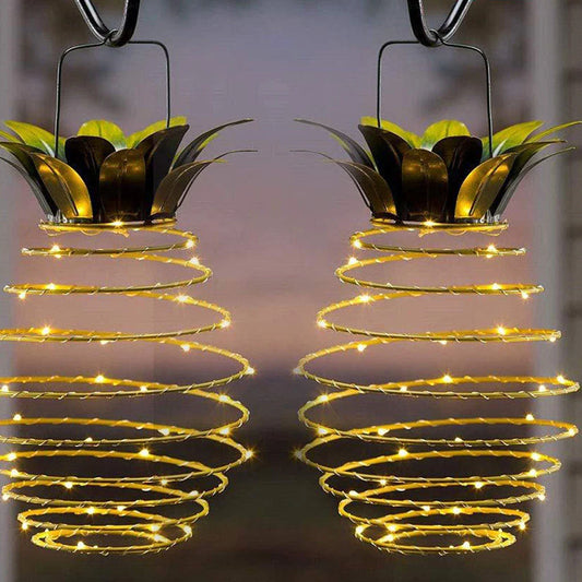 Elegant solar-powered garden lights with a whimsical pineapple design, automatically lighting up from dusk till dawn