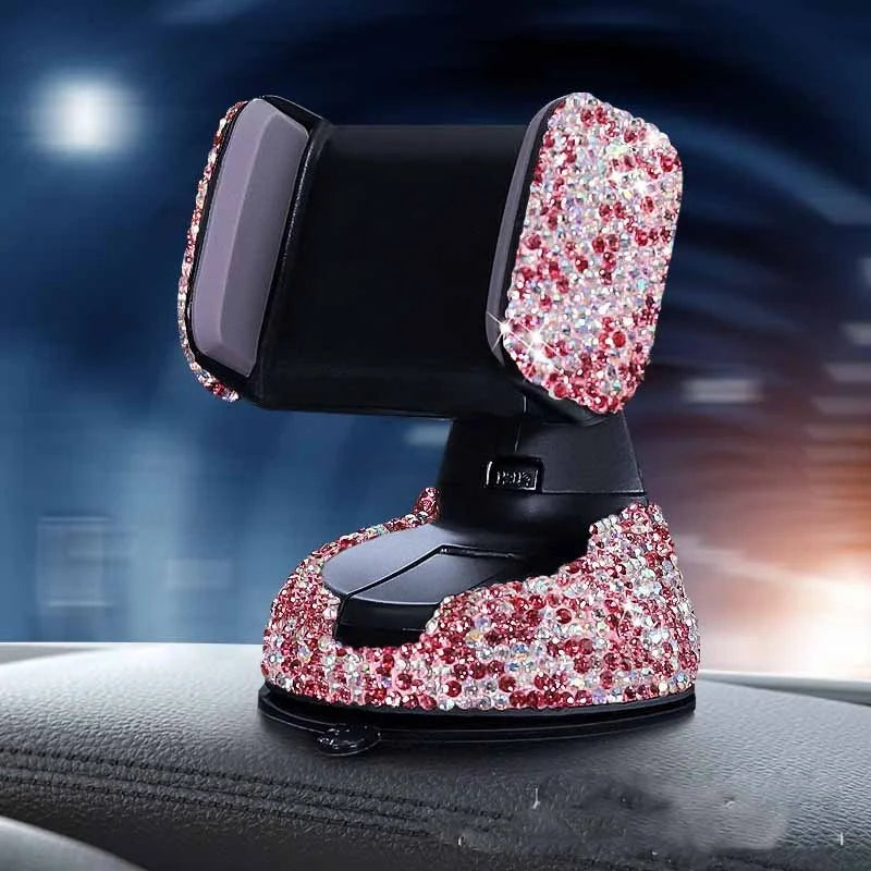 Diamond-encrusted car phone holder mounted on air vent with phone securely in place